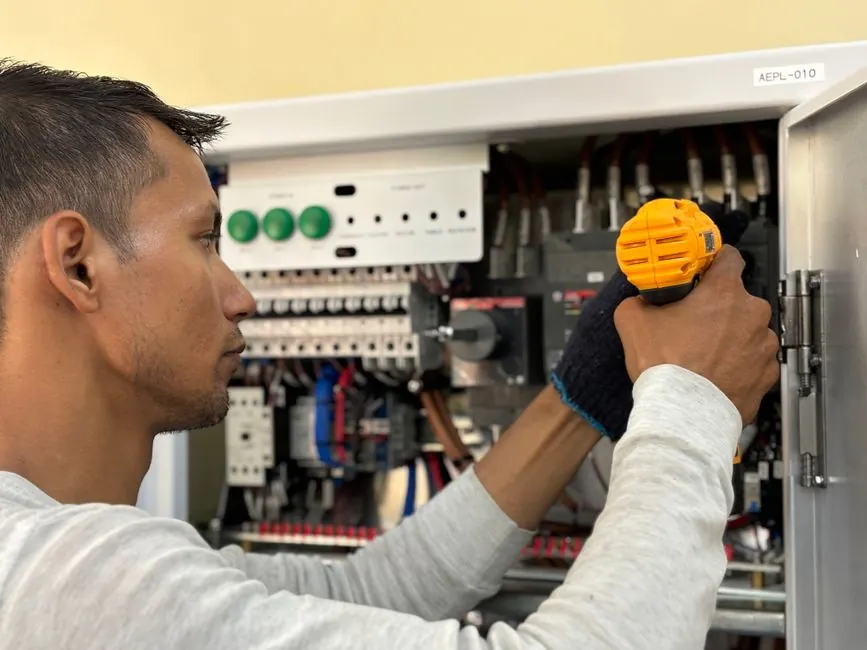 Technician using tools during a service visit
